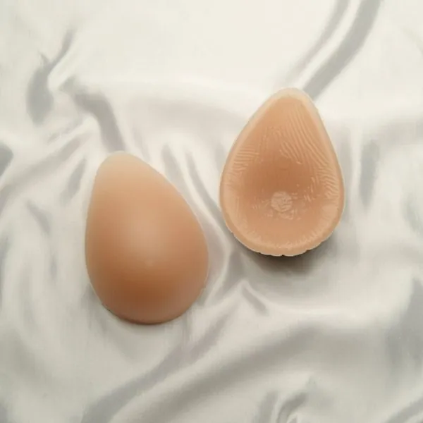 Two teardrop breast forms, front and hollow back