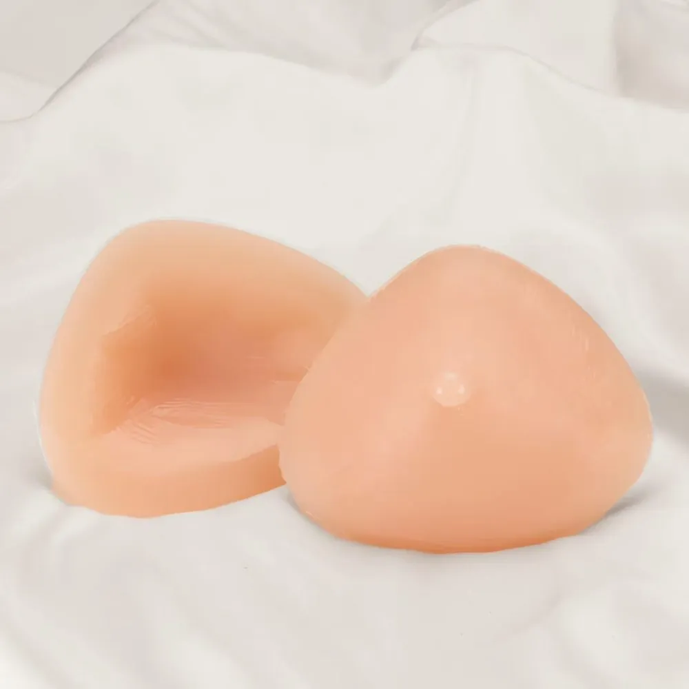 Two triangle breast forms, one showing the hollow back